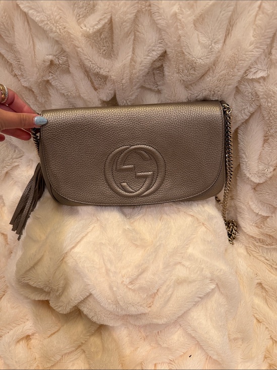 Gucci Handbags - Gucci Metallic Taupe Pebbled Leather Crossbody with Tassel